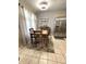 Eat-in kitchen with dining table, tile flooring, and large window at 5051 Nw 61St Ct, Ocala, FL 34482