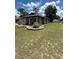 This home features a welcoming front porch and is enhanced by an expertly maintained lawn at 5051 Nw 61St Ct, Ocala, FL 34482