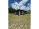This home features stone accents and is enhanced by an expertly maintained lawn at 5051 Nw 61St Ct, Ocala, FL 34482