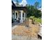 Close-up of front yard landscaping, with rock beds leading to the porch at 5051 Nw 61St Ct, Ocala, FL 34482