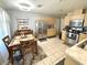 Eat-in kitchen with stainless steel appliances, tile flooring, and wooden cabinetry at 5051 Nw 61St Ct, Ocala, FL 34482