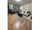 Cozy living room with hardwood floors and comfortable seating arrangement at 5051 Nw 61St Ct, Ocala, FL 34482