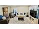 Spacious living room with hardwood floors, creating a warm and inviting atmosphere at 5051 Nw 61St Ct, Ocala, FL 34482