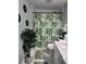 A compact bathroom featuring a shower/tub combo with tropical shower curtain and white sink at 508 Villa Del Sol Cir # 105, Orlando, FL 32824