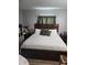 Bedroom features a large bed with decorative pillows and side tables, creating a comfortable retreat at 508 Villa Del Sol Cir # 105, Orlando, FL 32824