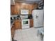 Efficient kitchen layout with essential appliances, ample storage, and bright countertops at 508 Villa Del Sol Cir # 105, Orlando, FL 32824
