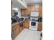 A functional kitchen with ample cabinet space, essential appliances, and a convenient layout at 508 Villa Del Sol Cir # 105, Orlando, FL 32824