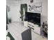 A cozy living room boasts stylish decor, including a modern entertainment center and chic accents at 508 Villa Del Sol Cir # 105, Orlando, FL 32824