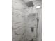 Elegant shower with marble-patterned tiles and a modern rainfall showerhead and handheld sprayer at 508 Villa Del Sol Cir # 105, Orlando, FL 32824