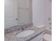 This bathroom features a granite countertop, modern faucet and fixtures, with a soaking tub and shower at 520 Silver Palm Dr, Haines City, FL 33844
