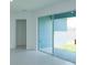 Open living area with a large sliding glass door allowing abundant natural light at 520 Silver Palm Dr, Haines City, FL 33844