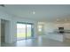 Bright, open living space with a sliding glass door leading to the backyard at 520 Silver Palm Dr, Haines City, FL 33844
