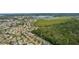 Expansive aerial view of a community near wetlands and green spaces at 541 Cokesbury Dr, The Villages, FL 32162