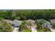 Aerial view of homes in a serene neighborhood with lush greenery and well-maintained landscaping at 541 Cokesbury Dr, The Villages, FL 32162