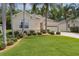 Charming home featuring lush green lawn, landscaping, and attached two-car garage at 541 Cokesbury Dr, The Villages, FL 32162