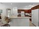 Bright kitchen with a breakfast bar, sleek countertops, stainless-steel appliances and wood cabinets at 541 Cokesbury Dr, The Villages, FL 32162