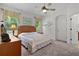 Cozy main bedroom featuring bright neutral walls, carpet, and ceiling fan at 541 Cokesbury Dr, The Villages, FL 32162