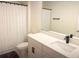 Clean bathroom featuring a shower with a curtain, toilet, and vanity with mirror at 591 Black Eagle Dr, Groveland, FL 34736