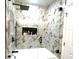 Modern shower features gray marble-style hexagon tile and a built-in niche at 591 Black Eagle Dr, Groveland, FL 34736