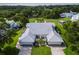 A beautiful aerial view of a single-Gathering home with lush landscaping and a sprawling green lawn at 6048 Topsail Rd, Lady Lake, FL 32159