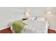 Comfortable bedroom featuring hardwood floors and a queen sized bed at 6048 Topsail Rd, Lady Lake, FL 32159