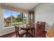 Bright breakfast nook with stunning outdoor views and hardwood floors at 6048 Topsail Rd, Lady Lake, FL 32159