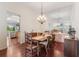 Elegant dining room with a wooden table, chandelier and mirrored wall at 6048 Topsail Rd, Lady Lake, FL 32159