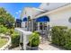 Charming home exterior with a well-manicured garden and inviting entrance at 6048 Topsail Rd, Lady Lake, FL 32159