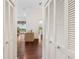Inviting hallway with hardwood floors leading to bright living spaces at 6048 Topsail Rd, Lady Lake, FL 32159