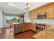 Well-equipped kitchen with stainless steel appliances, granite countertops, and ample natural light at 6048 Topsail Rd, Lady Lake, FL 32159