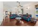 Inviting living room with hardwood floors, comfortable seating, and natural light creating a warm atmosphere at 6048 Topsail Rd, Lady Lake, FL 32159