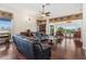Spacious living room featuring hardwood floors and large windows with scenic views at 6048 Topsail Rd, Lady Lake, FL 32159