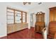 Cozy office with custom built-ins and hardwood floors for a functional workspace at 6048 Topsail Rd, Lady Lake, FL 32159