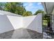 A private outdoor patio area with brick flooring and an iron gate at 6048 Topsail Rd, Lady Lake, FL 32159