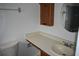 Bathroom featuring a toilet, vanity, and cabinet at 610 Swallow Ct, Apopka, FL 32712