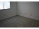 Empty bedroom featuring carpet and a window at 610 Swallow Ct, Apopka, FL 32712