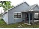 Rear exterior elevation of the home, featuring vinyl siding and a screened porch at 610 Swallow Ct, Apopka, FL 32712