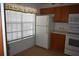 Eat-in kitchen area with window and white refrigerator at 610 Swallow Ct, Apopka, FL 32712