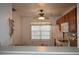 View of kitchen featuring a ceiling fan and window at 610 Swallow Ct, Apopka, FL 32712