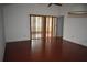 Living room featuring hardwood floors and a sliding glass door at 610 Swallow Ct, Apopka, FL 32712