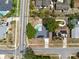 An aerial view shows a home with a pool, solar panels, and a well-maintained street and neighborhood at 6221 Ambassador Dr, Orlando, FL 32808