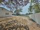 A large backyard featuring a privacy fence, trees, and potential for outdoor enjoyment at 6221 Ambassador Dr, Orlando, FL 32808