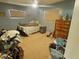 A bedroom that includes a bed, dresser, ceiling fan, and two windows at 6221 Ambassador Dr, Orlando, FL 32808