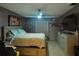 Cozy bedroom with carpet flooring, storage bed frame, and modern gray furniture at 6221 Ambassador Dr, Orlando, FL 32808