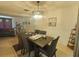 Dining room with tile flooring, modern lighting fixture, and seating for six at 6221 Ambassador Dr, Orlando, FL 32808