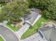 Aerial shot of home with well-maintained landscaping, spacious driveway, and screened-in pool area at 628 San Pedro Dr, The Villages, FL 32159