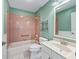 Bathroom showcasing pink tile and combined shower and bath at 628 San Pedro Dr, The Villages, FL 32159