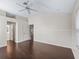 Large bedroom with hardwood floors, offering ample space and potential for customization at 628 San Pedro Dr, The Villages, FL 32159