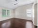 Spacious bedroom showcasing beautiful hardwood floors, bright natural light, and vaulted ceilings at 628 San Pedro Dr, The Villages, FL 32159