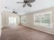 Bright living room with sliding doors to an outdoor patio/pool area, perfect for indoor-outdoor living at 628 San Pedro Dr, The Villages, FL 32159